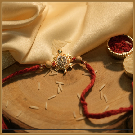 Auspicious Golden Tortoise Rakhi With Diamonds